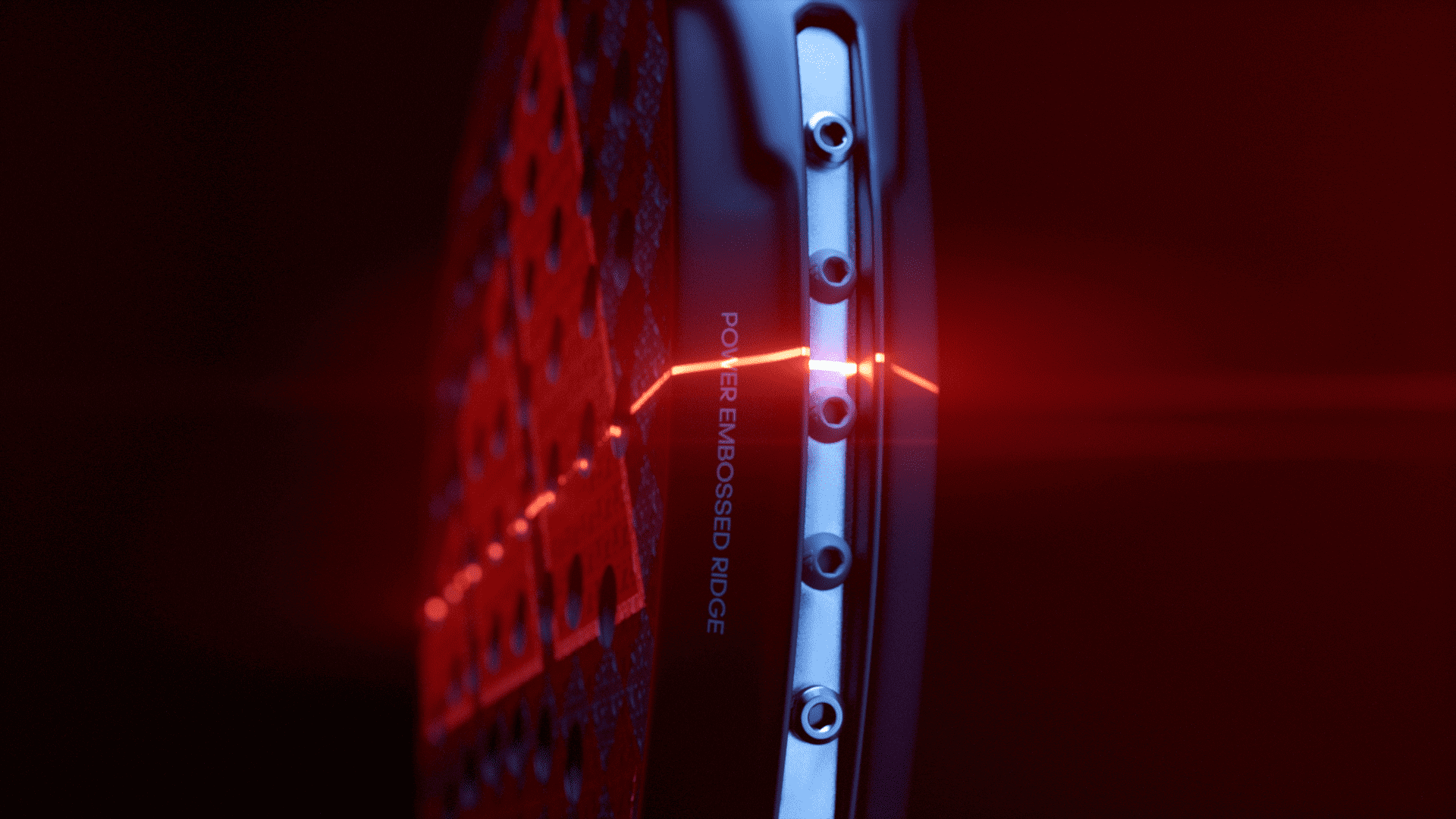 Adidas Padel .23 — A close up of a bike wheel with a red glowing line.