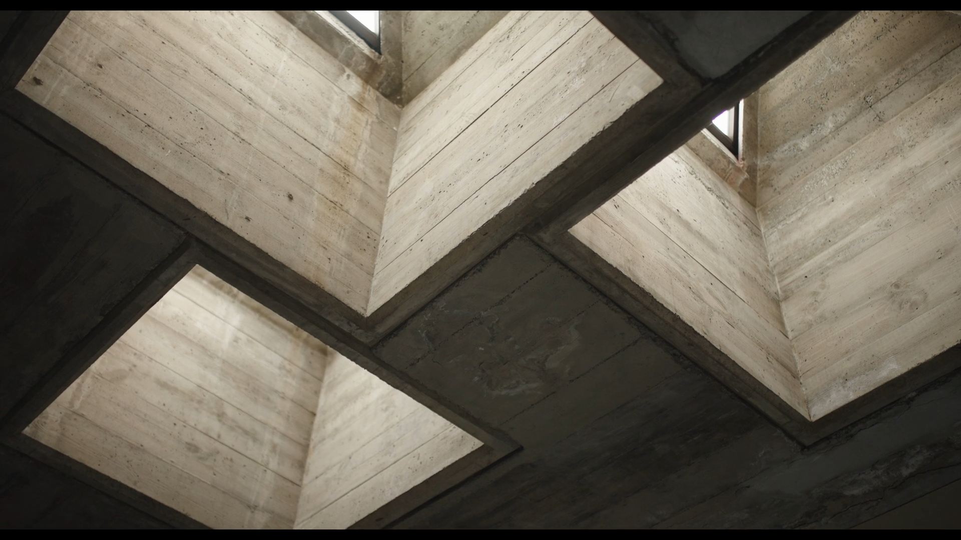 COACTF — A view of a concrete building with a window.